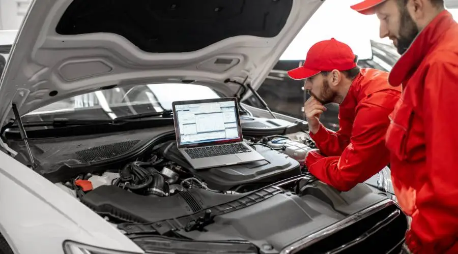 Professional mechanic performing logbook service diagnostic check Slacks Creek workshop