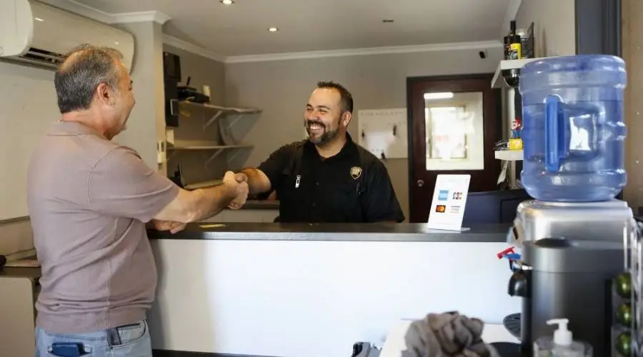 Toros mechanic explaining vehicle diagnostic results to customer professional consultation best service Slacks Creek