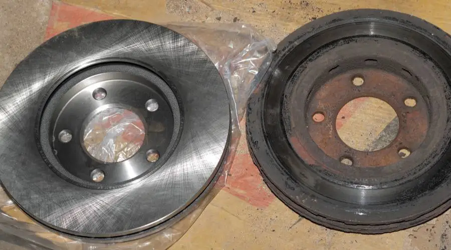 Comparison worn brake pads rotors suspension components versus new parts replacement timing