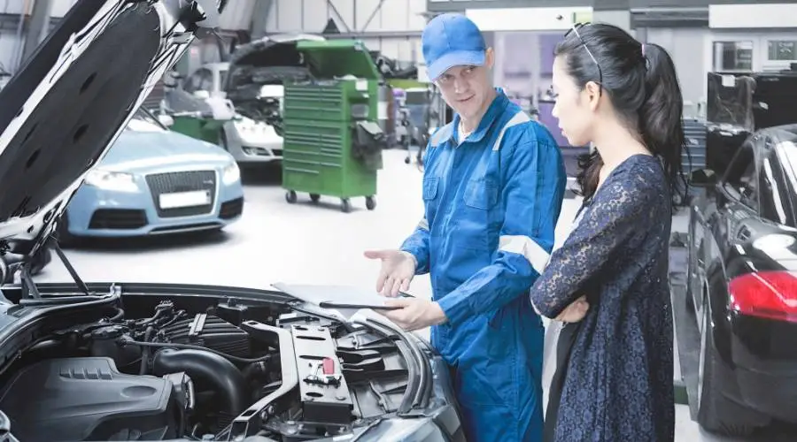 Licensed Queensland examiner explaining roadworthy certificate costs and validity to customer