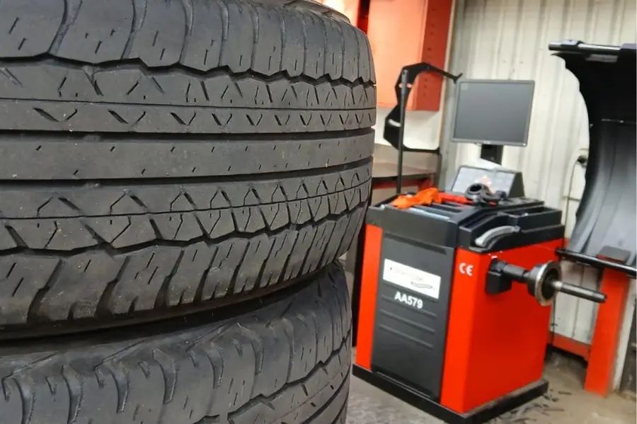 Close-up of tires in an auto repair shop.