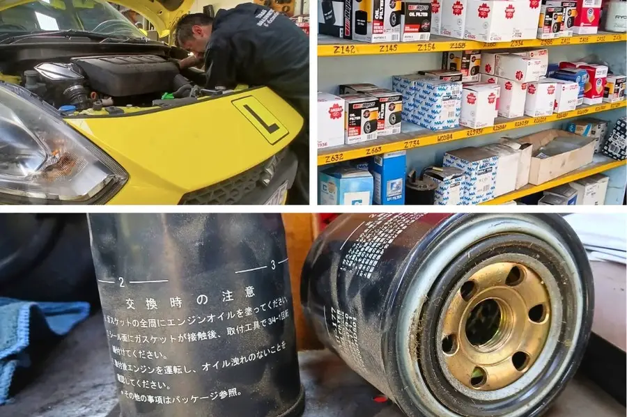 Car repair shop with filters and mechanic working.